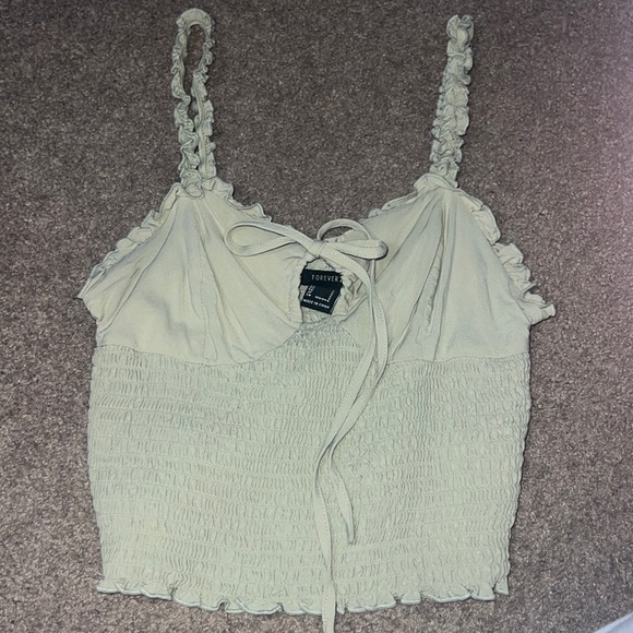 Seed Ruffle Tank Forever 21 | Tops | Forever 2 Sage Green Ruffled Tank With A Tie In The ...